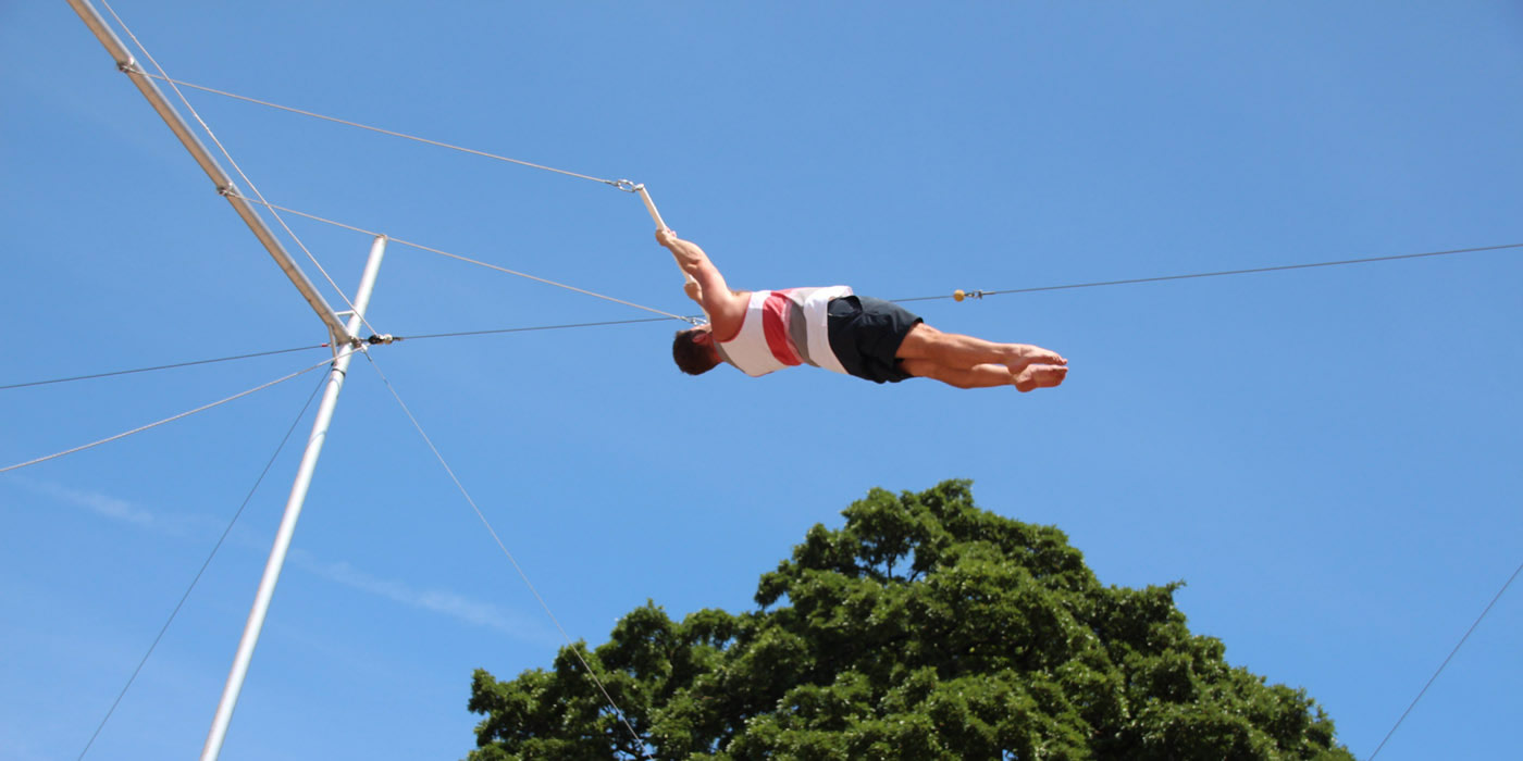 Man flying on trapeze